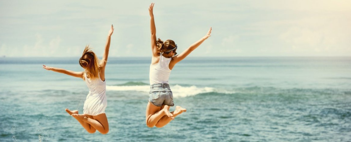 people jumping into the ocean