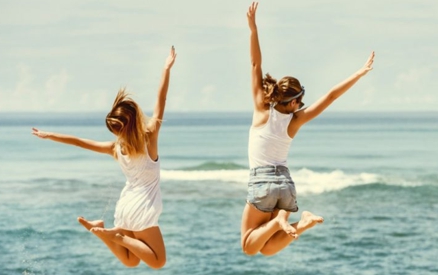 people jumping into the ocean